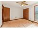 Bedroom with closet, ceiling fan, and natural light at 2541 Deer Isle Cv, Lawrenceville, GA 30044