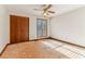 Bedroom with closet, window, and ceiling fan at 2541 Deer Isle Cv, Lawrenceville, GA 30044