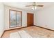 Bedroom with a ceiling fan, closet, and a window, ready for renovation at 2541 Deer Isle Cv, Lawrenceville, GA 30044