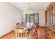 Traditional dining room featuring a wooden table, chairs, and a vintage chandelier at 2541 Deer Isle Cv, Lawrenceville, GA 30044