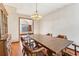 Traditional dining room featuring a wooden table, chairs, and a vintage chandelier at 2541 Deer Isle Cv, Lawrenceville, GA 30044