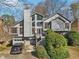 Charming two-story home featuring a wood facade, multi-level deck, and attached two-car garage at 2541 Deer Isle Cv, Lawrenceville, GA 30044