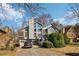 Charming two-story home featuring a wood facade, multi-level deck, and attached two-car garage at 2541 Deer Isle Cv, Lawrenceville, GA 30044