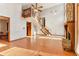 Bright living room with wood floors and a fireplace, adjacent to a staircase at 2541 Deer Isle Cv, Lawrenceville, GA 30044