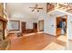 Bright living room with wood floors and a fireplace, adjacent to the kitchen at 2541 Deer Isle Cv, Lawrenceville, GA 30044