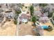 Aerial shot of the property revealing a pool, well manicured yard, and the home's placement amongst other properties at 3167 Bay View Dr, Jonesboro, GA 30236