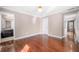 Bedroom with gleaming hardwood floors, adjoining bathroom, and white molding at 3167 Bay View Dr, Jonesboro, GA 30236