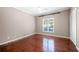 Bedroom featuring hardwood floors, white molding, and closet at 3167 Bay View Dr, Jonesboro, GA 30236