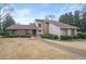 A well-manicured front yard with a stone and stucco facade at 3167 Bay View Dr, Jonesboro, GA 30236