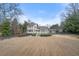 A view of the home's exterior showing the backyard, deck, and staircase at 3167 Bay View Dr, Jonesboro, GA 30236