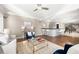 Bright living room featuring a wet bar with tile accents, hardwood floors and neutral paint tones at 3167 Bay View Dr, Jonesboro, GA 30236