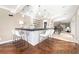 Entertain in this wet bar featuring a stone accent wall, floating shelves, and pendant lighting at 3167 Bay View Dr, Jonesboro, GA 30236