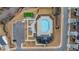 Aerial view of the community pool area featuring a pool, playground, and parking at 335 Tillman Pass, Woodstock, GA 30188