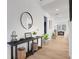 Hallway with light wood floors and decorative table at 335 Tillman Pass, Woodstock, GA 30188