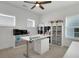 Well-lit home office space with white walls, storage shelves and a ceiling fan at 335 Tillman Pass, Woodstock, GA 30188