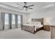 Spacious main bedroom boasts natural light, tray ceiling and neutral finishes at 335 Tillman Pass, Woodstock, GA 30188