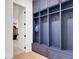 Mudroom with blue locker-style storage and drawer space at 335 Tillman Pass, Woodstock, GA 30188