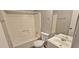 This is a neutral-colored bathroom with a shower-tub combo, single sink vanity, and an elongated toilet at 508 Jaywood Dr, Stone Mountain, GA 30083