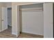 Bedroom closet with wooden floors, bi-fold doors, and closet rod at 508 Jaywood Dr, Stone Mountain, GA 30083