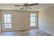 Light-filled bedroom with neutral walls, vinyl floors and ceiling fan at 508 Jaywood Dr, Stone Mountain, GA 30083