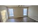 Bedroom with two windows providing natural light and vinyl plank flooring and a ceiling fan at 508 Jaywood Dr, Stone Mountain, GA 30083