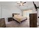 Spacious bedroom with carpet, ceiling fan, and comfortable bed, providing a relaxing retreat at 6089 Mallory Rdg, Union City, GA 30291