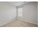 Cozy bedroom offers a bright window, neutral carpet, and ample natural light at 6089 Mallory Rdg, Union City, GA 30291