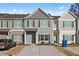 Charming townhome featuring neutral siding, a concrete driveway, and well-maintained landscaping, creating a welcoming curb appeal at 6089 Mallory Rdg, Union City, GA 30291