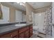 Full bathroom featuring a shower-tub combo and dark wood cabinets at 8885 Camp Tree Ct, Winston, GA 30187