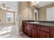 Bathroom featuring a vanity with dark countertops, wooden cabinets, and neutral walls at 8885 Camp Tree Ct, Winston, GA 30187