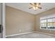 Comfortable bedroom with neutral walls and a window bringing in natural light at 8885 Camp Tree Ct, Winston, GA 30187