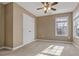 Cozy bedroom with natural light, plush carpet, and a double door closet at 8885 Camp Tree Ct, Winston, GA 30187