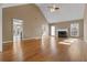 Spacious living room with fireplace, vaulted ceiling, and gleaming hardwood floors at 8885 Camp Tree Ct, Winston, GA 30187