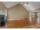 Spacious living room featuring a fireplace, high ceilings, and hardwood floors at 8885 Camp Tree Ct, Winston, GA 30187