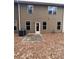 Backyard exterior featuring a door, windows, and patio area at 256 Oakview Dr, Canton, GA 30114