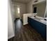 Bathroom featuring double sinks, blue cabinets and modern fixtures at 256 Oakview Dr, Canton, GA 30114