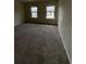 Bedroom featuring neutral carpet and natural light from windows at 256 Oakview Dr, Canton, GA 30114