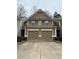 Inviting two-story home with a double garage and neutral-colored siding at 256 Oakview Dr, Canton, GA 30114