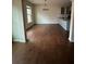 Open living room showcasing hardwood floors and a kitchen view at 256 Oakview Dr, Canton, GA 30114