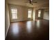 Open living room with abundant windows and hardwood floors at 256 Oakview Dr, Canton, GA 30114