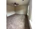 Spacious living room with carpet flooring and a ceiling fan with lighting at 256 Oakview Dr, Canton, GA 30114