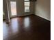 Cozy living room featuring hardwood floors and a door to the backyard at 256 Oakview Dr, Canton, GA 30114