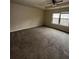 Spacious main bedroom with neutral carpet, a ceiling fan, and natural light at 256 Oakview Dr, Canton, GA 30114