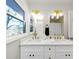 Bathroom with and mirrors, new fixtures, and a bright window at 3187 Clifton Church Rd, Atlanta, GA 30316