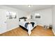 Cozy bedroom with hardwood floors and bright natural light from two windows at 3187 Clifton Church Rd, Atlanta, GA 30316