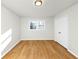 Empty bedroom featuring hardwood floors and bright natural light from one window at 3187 Clifton Church Rd, Atlanta, GA 30316