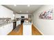 Bright kitchen features granite countertops, white cabinets, stainless steel appliances, and an eat-in island at 3187 Clifton Church Rd, Atlanta, GA 30316