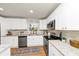 The updated kitchen has white cabinets, granite countertops, stainless steel appliances, and a subway tile backsplash at 3187 Clifton Church Rd, Atlanta, GA 30316