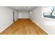 A bright living room featuring freshly painted walls and beautiful wood-look floors at 3187 Clifton Church Rd, Atlanta, GA 30316