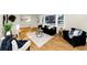 Comfortable living room featuring hardwood floors, a large window, and comfortable furniture, with plants and artwork at 3187 Clifton Church Rd, Atlanta, GA 30316